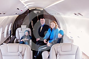 Family traveling by commercial air jet