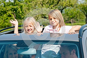 Family travelling by car