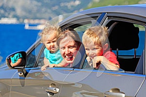 Family travelling by car on sea vacation