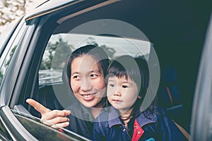 Family travelling by car on vacation. Outdoors.