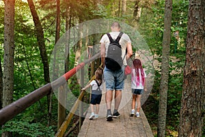 The family travels along ecological hiking trails in the forest
