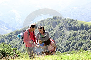 Family on a trekking day in mountains