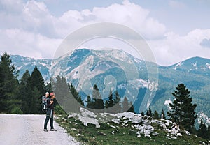 Family on a trekking day in the mountains. Velika Planina or Big