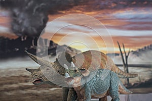 Family of triceratops with jurassic land into background