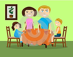 A family with two children is drinking tea at a table.