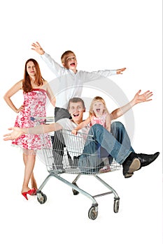 Family with two children with shopping basket