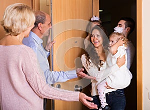 Family with two daughters visiting grand parents