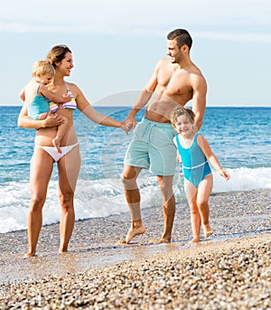 Family with two kids on beach