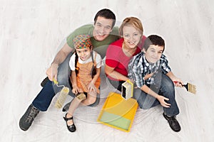 Family with two kids ready to pait their home