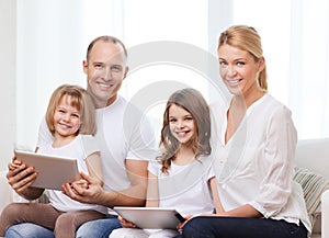 Family and two kids with tablet pc computers