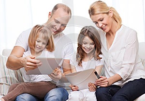 Family and two kids with tablet pc computers