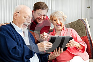 Family Uses Tablet PC and Laughs