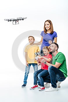 Family using hexacopter drone isolated photo