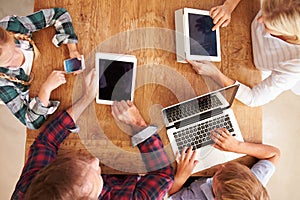 Family using new technology, overhead view