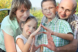 Family is using their hands to represent home
