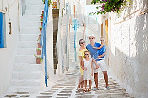 Family having fun outdoors on Mykonos streets