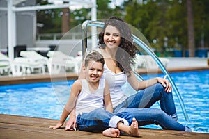 Family On Vacation Having Fun at Outdoor Pool