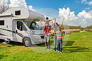 Family vacation, RV travel with kids, happy parents with children have fun on holiday trip in motorhome