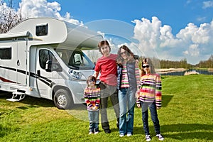 Family vacation, RV travel with kids, happy parents with children have fun on holiday trip in motorhome, camper