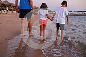 Family vacation at sea at sunrise.