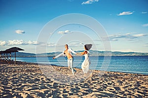 Family and valentines day. Summer holidays and travel vacation. Sexy woman and man at sea. Couple in love dance on beach