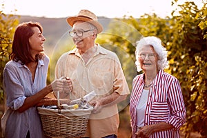 Family in vineyard before harvesting