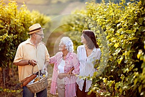 Family vineyard - Senior winemakers with daughter in vineyard