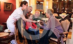 Family visit grandparents at nursing home