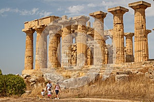 Family visiting ruined temple