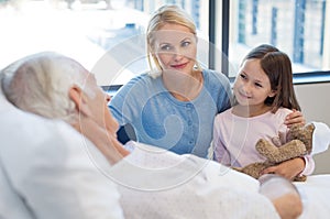 Family visiting senior patient