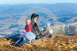 Family walk on autumn mountain plateau