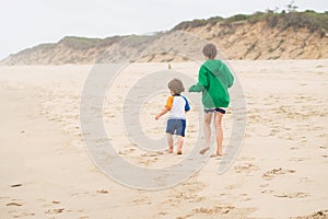 Family walk on the beach