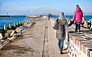 Family walk on Darlowo pier