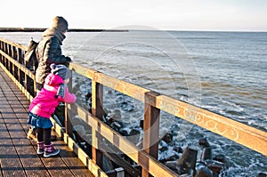 Family walk on Darlowo pier