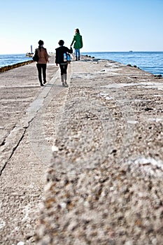 Family walk on Darlowo pier