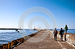 Family walk on Darlowo pier