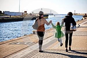 Family walk on Darlowo pier
