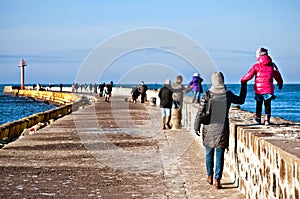 Family walk on Darlowo pier