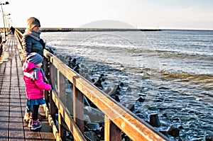 Family walk on Darlowo pier