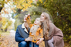 Family walk in the forest in autumn birds