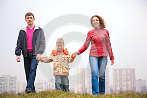 Family walk outdoor in city