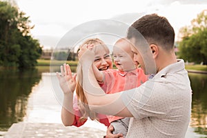 Family walk in the park. Family walks in the park. Man, woman and child in nature