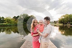 Family walk in the park. Family walks in the park. Man, woman and child in nature