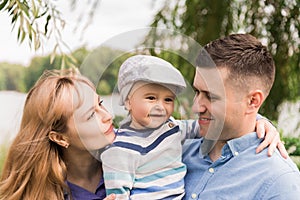 Family walk in the park. Family walks in the park. Man, woman and child in nature