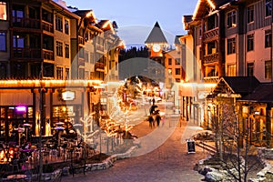 Ski/Snowboard Town lit at Night, with family fun at `The Village` Mammoth Mountain, California USA