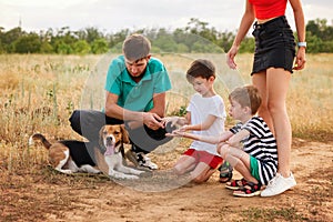 Family walk and training dog