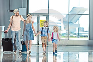 Family walking in airport