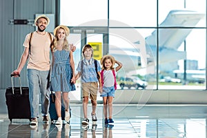 Family walking in airport