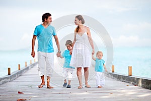 Family walking along jetty