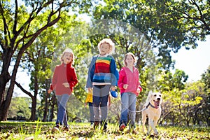 Family walking in autumn park. Fall fun